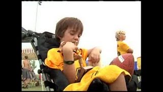 Local football team helps 9 year old boy play in the game again