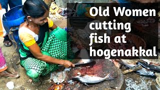 Women Cutting Live Fish
