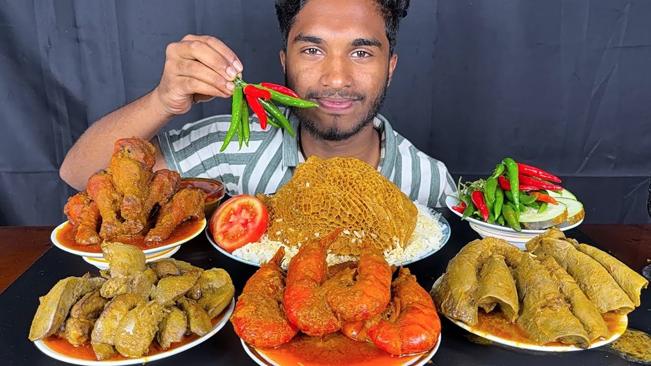 eating spicy chicken curry, chicken liver, prawns masala curry, goat full lungs and boti with rice