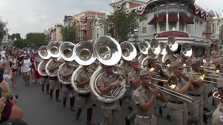 Fightin' Texas Aggie Band March down Main Street a...