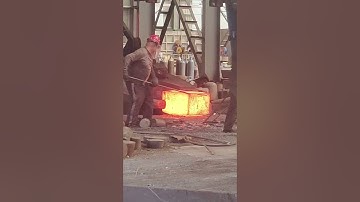 Forge this giant rectangular iron block at high temperature. Dangerous forging