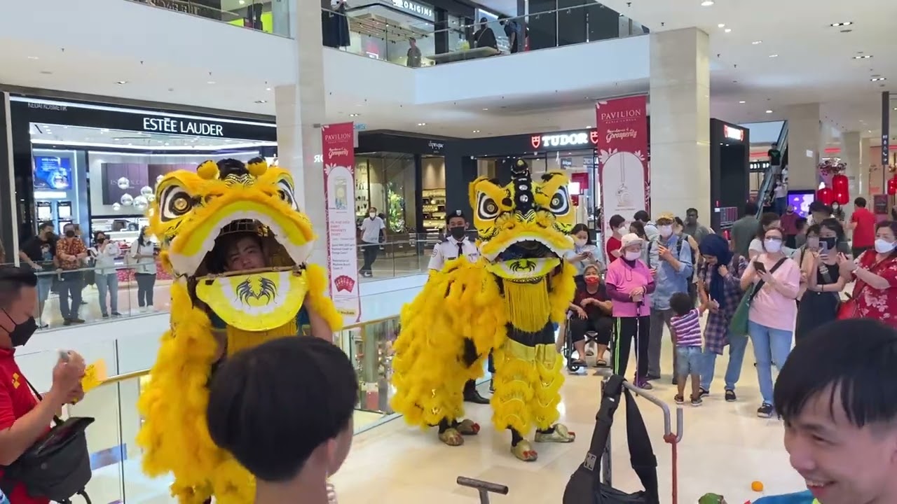 Traditional lion dance performance by Xuan Long around pavilion Bukit Bintang