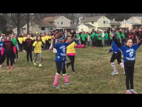 The Eleanor Roosevelt Elementary School cheerleaders perform at halftime during the Super Duper Bowl