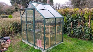 How to replace greenhouse glass panels.Storm damage Repair.