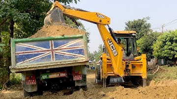 Loading Soil With Backhoe Loader In Tripper Dump Village Area