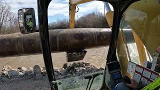 Causeway and large pipe removal in a river