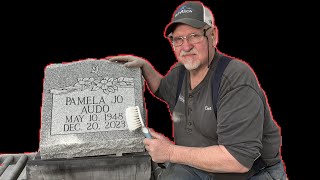 Cleaning a headstone before delivery