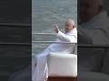 Pope francis seen by boat on the canals of venice