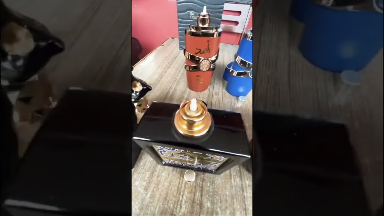 Real vs Fake Lattafa Assad Bourbon by its decanter.