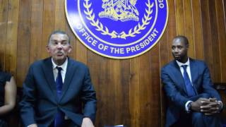 His Excellency Anthony Carmona O.R.T.T., S.C., and Dennis Lawrence offer advice to young footballers