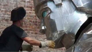 22-foot-tall hockey player sculpture installed outside Prudential Center