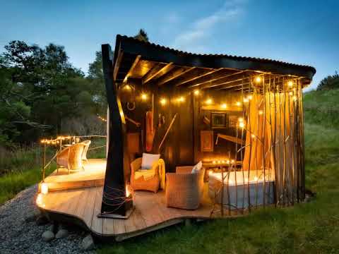 Halcyon Glamping Cabin with outdoor bath tub and wood burning fire, Loch Lomond in central Scotland.