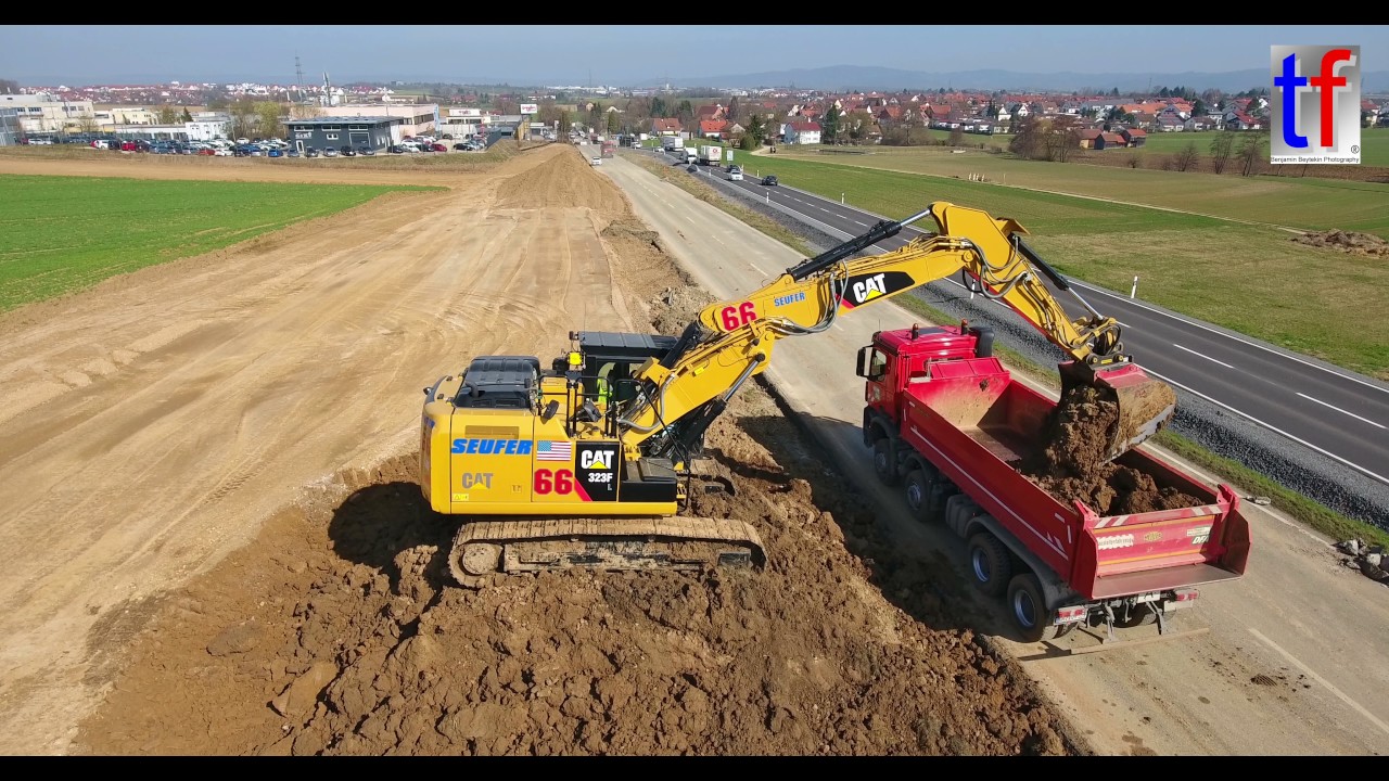 CATERPILLAR 323F L Loads Dump Trucks, Ausbau B14 Nellmersbach -  Waldrems, 16.03.2017. #1