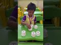 sachit playing with cups