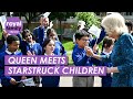 Queen camilla opens a new coronation library at a primary school