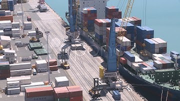 Container Loading Onto Ship Busy Timelapse. Stock Footage