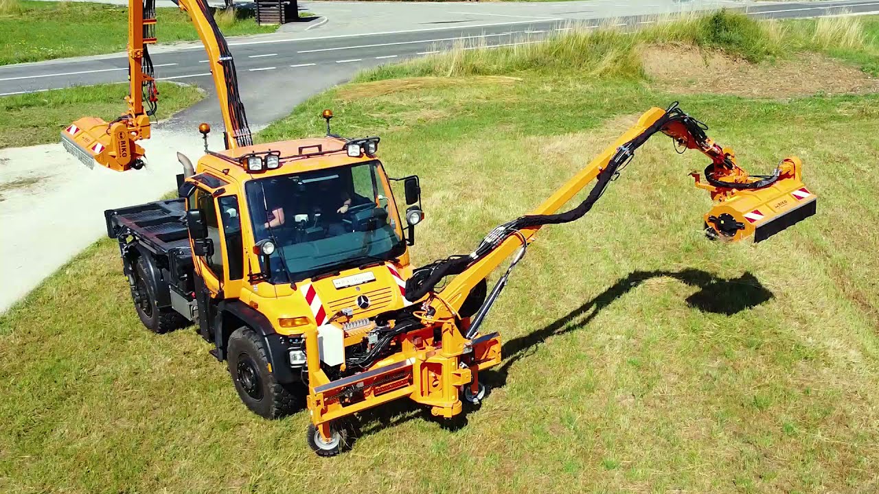 Mercedes Benz Unimog equipped with TWO powerful mowers