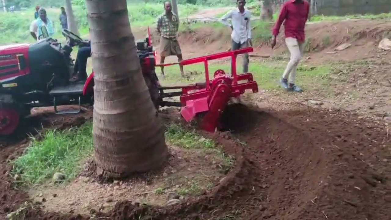 Mahindra Oja+ Reverse forward Rotovator in Ring Trenching in Coconut Farm