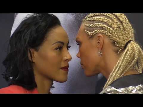 Female Boxer Goes In For The Kiss During Staredown
