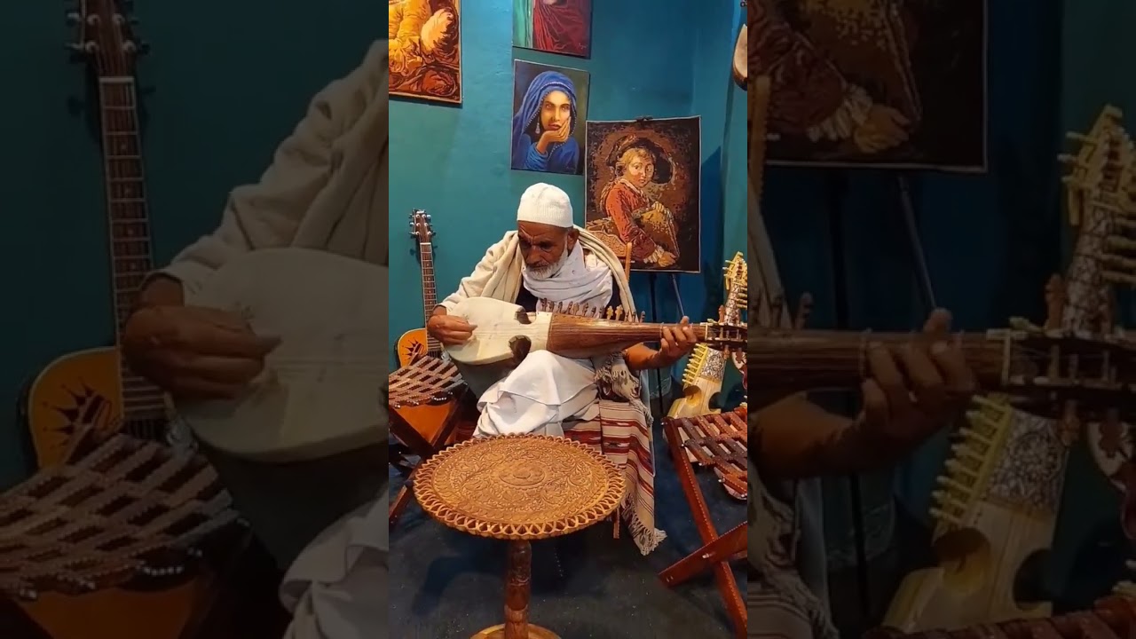 Music_shop_peshawar fast rabab playing by an old man 