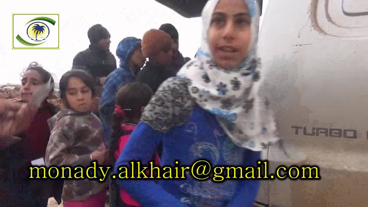 منادي الخير - 711 - توزيع الخبز في مخيم حفصة أم المؤمنين - ادلب - سوريا - 14-1-2016