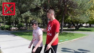 How to guide a visual impaired person?