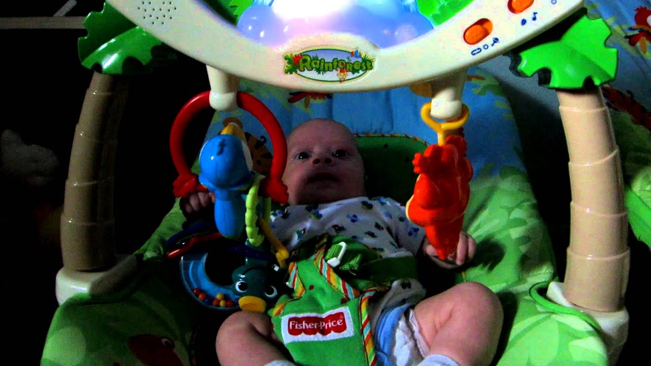Ross playing with toys on his bouncy seat YouTube