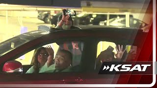 Spurs fans celebrate, honk horns on East Commerce Street after Spurs' first playoff win since 2019