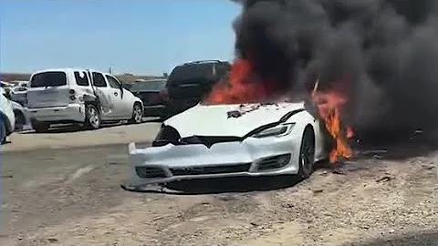 Firefighters put out a Tesla car fire that kept reigniting