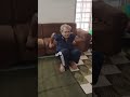 70 YEARS YOUNG MAN DOING YOGA CHAIR SIT -UPS BY THE HELP OF YOGA INSTRUCTOR PARANGI RAVI