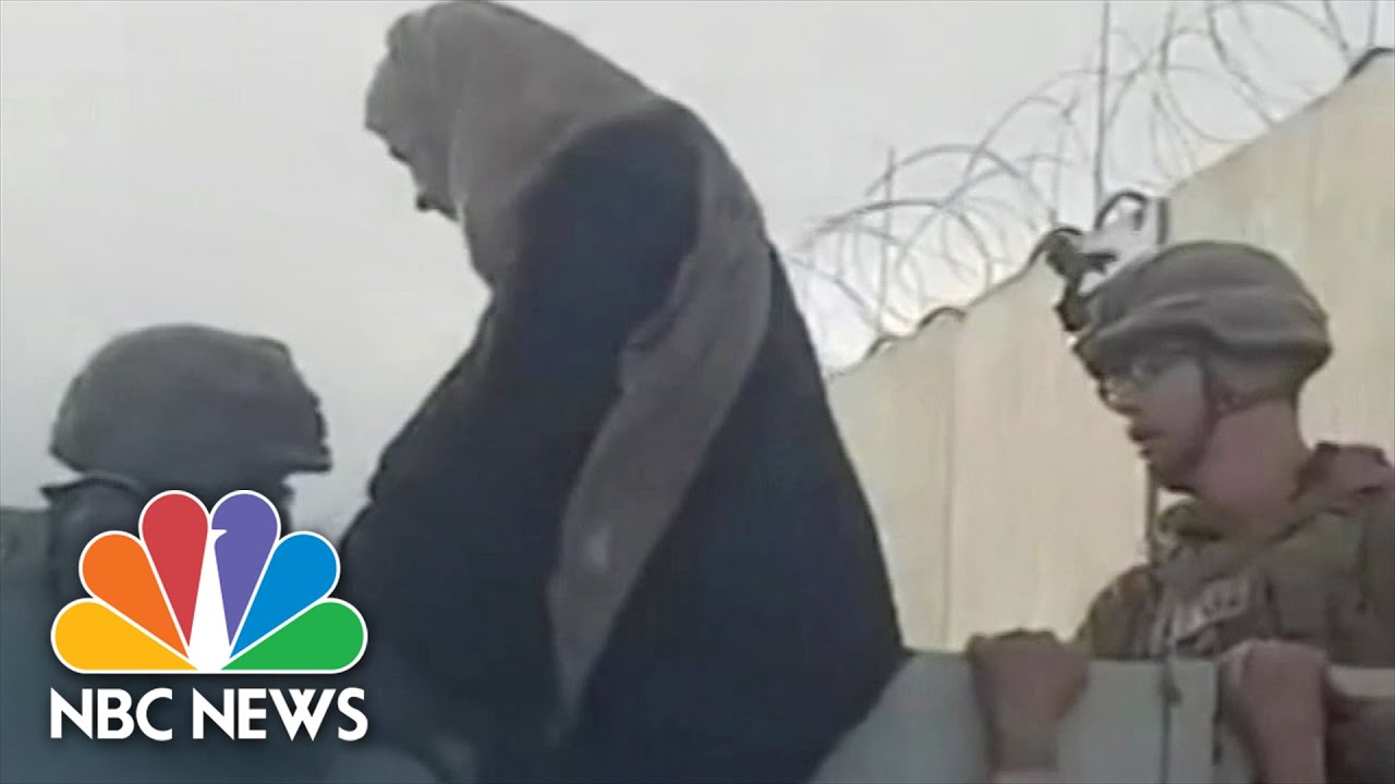 Watch: Woman, Child Lifted Over Kabul Airport Wall by U.S. Soldiers