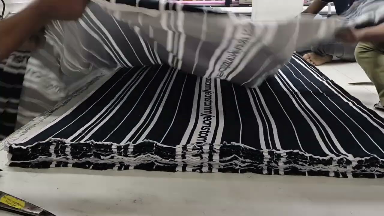Stripe fabric cutting for polo shirt. 