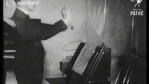 MUSIC: Professor Theremin of Leningrad demonstrates music making invention. (1927)