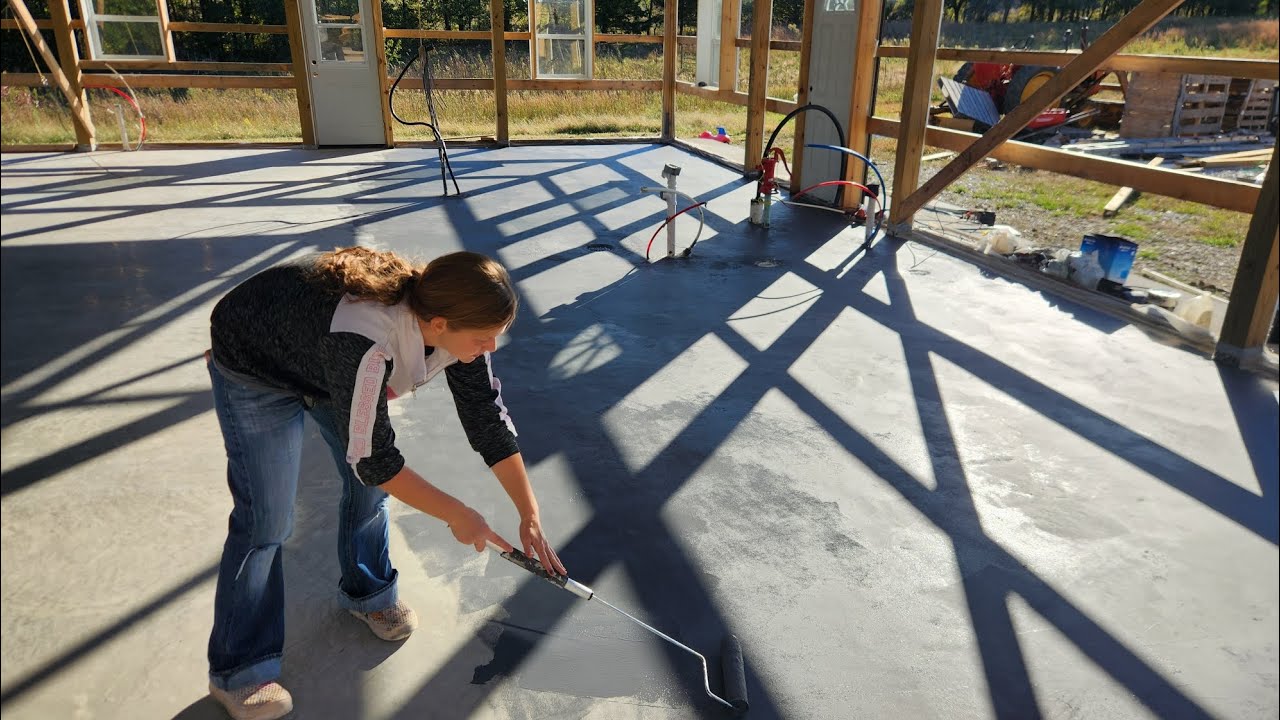 Staining the concrete slab in the post frame build 
