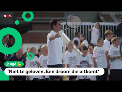 Children get a tennis lesson from tennis hero Roger Federer