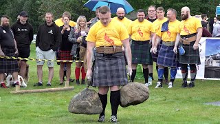 Strongmen take the Nicol Stone carry challenge during 2019 Donald Dinnie Games in Scotland