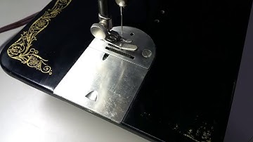 Remove Singer 66 bobbin case in less than 60 seconds.
