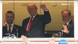 President Trump gets mixed reactions as he swears in military enlistees at Commanders game