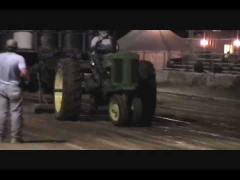 First pull on my 1955 John Deere 60 at Hamilton County Fair, Noblesville Indiana, in 7500 lb class, with thunderstorms surrounding the track. Just bought this tractor in March, so first pull outing for this machine. She didn't run out of horses... July 17, 2010