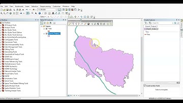 How to Split a polygon by an overlapping line feature in ArcMap