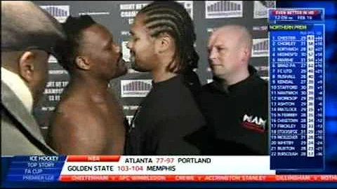 Dereck Chisora kisses Carl Baker during a staredown