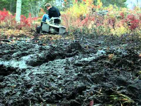 Lawn tractor mudding, pozzi rear end. pt. 2