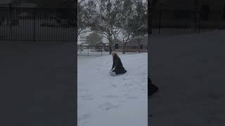 Sledding on a yoga matt in a trash bag