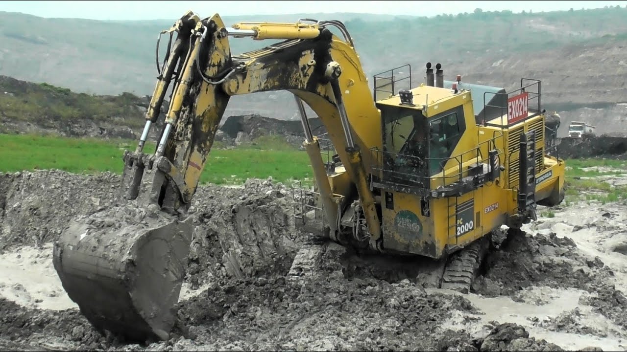 Muddy Loading Operation: Komatsu PC2000 Shows Full Power in Muddy Conditions with HD785 & CAT 777
