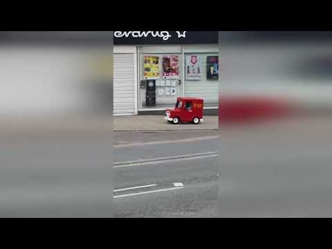 Hilarious video shows "Postman Pat" driving along streets in tiny van