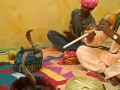 Snake charmers play music for 2 cobras in Jaipur, India.