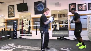 Ricky Hatton on the pads with Nigel Benn