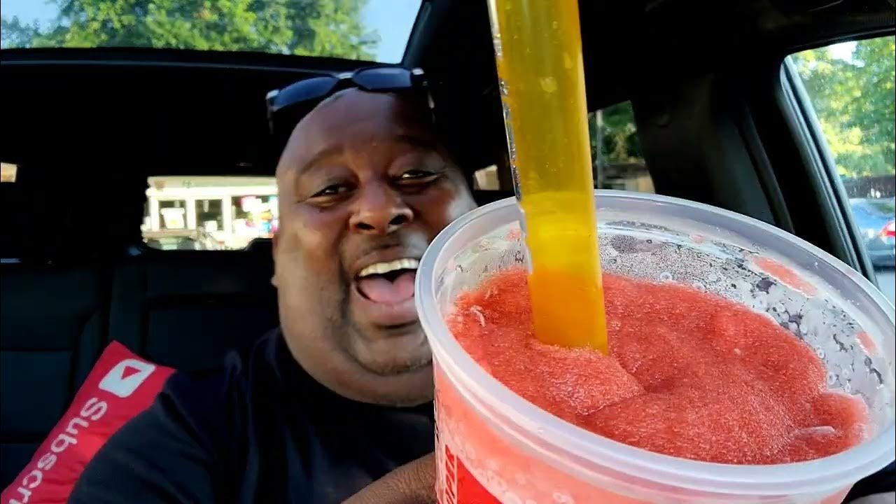 sipping-a-super-big-gulp-size-slurpee-thru-a-big-straw-in-seconds-for