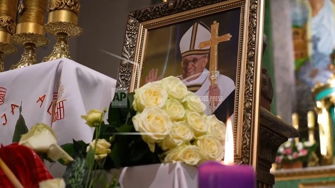 Ukrainian faithful gather at a cathedral in Kyiv to pray for Pope Francis