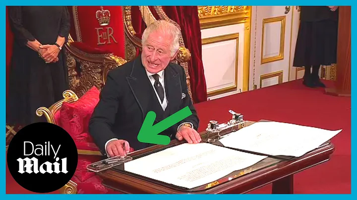 Moment King Charles III furiously motions for aide...